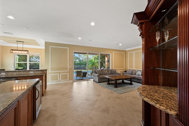 tiled living room with ornamental molding