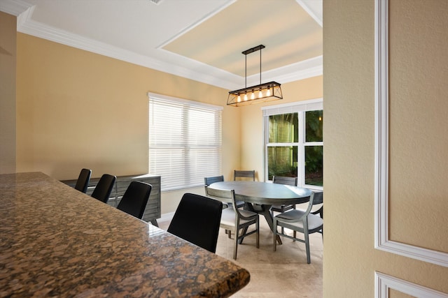 dining space with ornamental molding