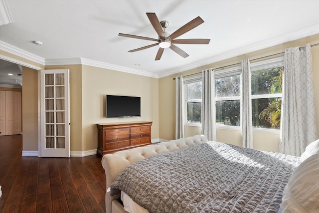 bedroom featuring ornamental molding, dark hardwood / wood-style floors, and multiple windows