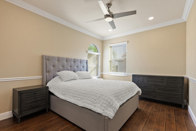 bedroom featuring crown molding, dark wood-type flooring, and ceiling fan