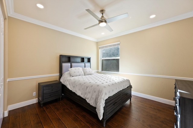 bedroom featuring ceiling fan, ornamental molding, and dark hardwood / wood-style floors