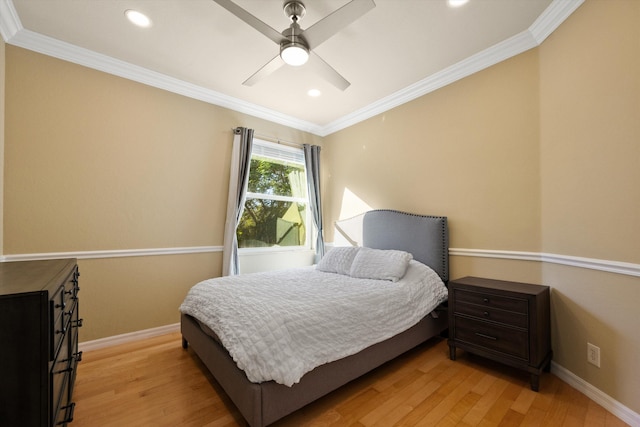 bedroom with ornamental molding, ceiling fan, and light wood-type flooring