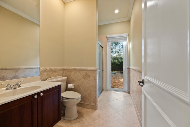 bathroom featuring ornamental molding, vanity, tile patterned floors, and toilet