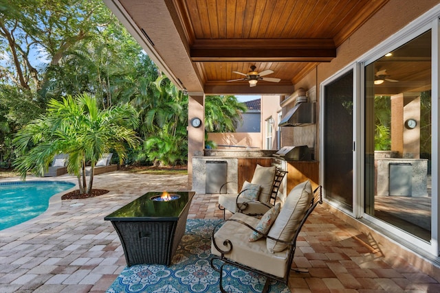 view of patio / terrace featuring grilling area, ceiling fan, and exterior bar