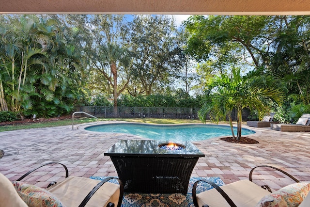 view of swimming pool featuring a patio area