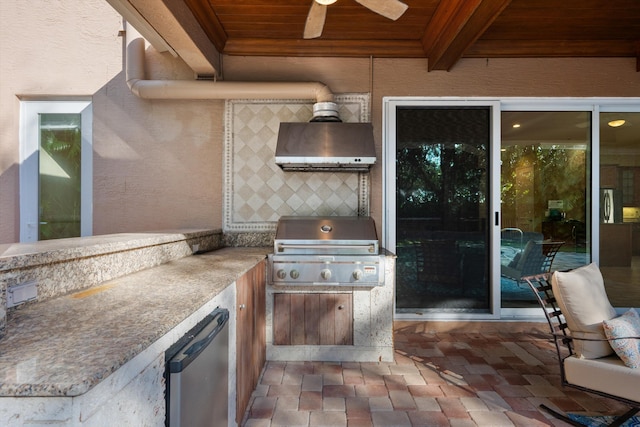 view of patio with area for grilling and ceiling fan