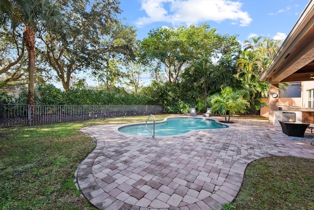 view of swimming pool featuring a patio area