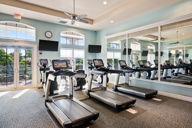 exercise room featuring a wealth of natural light, french doors, ceiling fan, and carpet