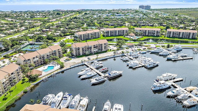 birds eye view of property with a water view