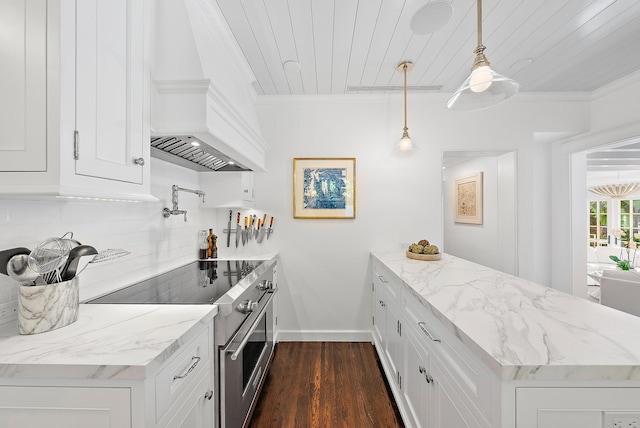 kitchen featuring dark hardwood / wood-style flooring, white cabinetry, stainless steel range, and pendant lighting