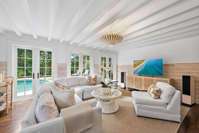 sunroom / solarium featuring a chandelier, french doors, and beam ceiling