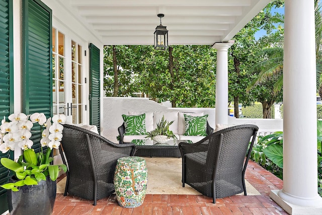 view of patio with a porch and french doors