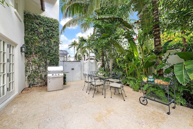 view of patio featuring area for grilling and french doors