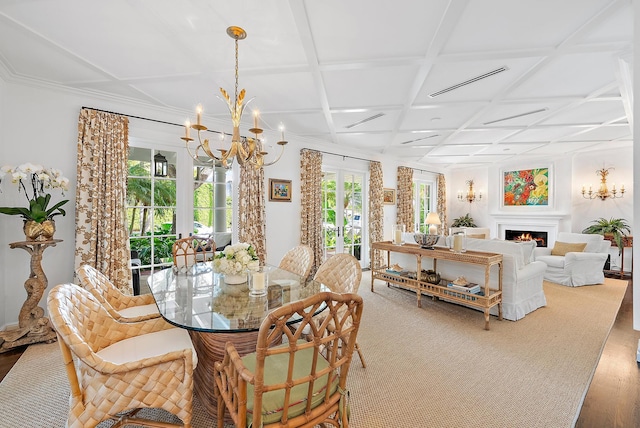 dining area featuring wood-type flooring, coffered ceiling, and an inviting chandelier