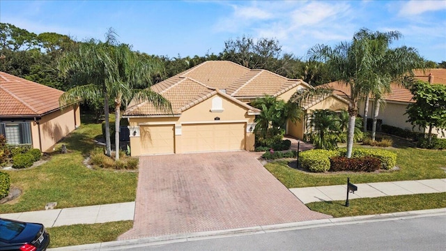 view of front facade with a garage and a front yard