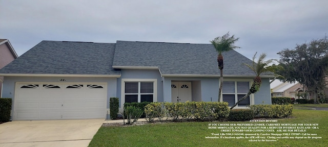 view of front of house featuring a garage and a front yard