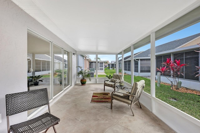 sunroom / solarium with a residential view