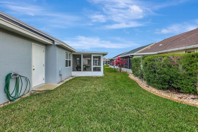 view of yard featuring a sunroom