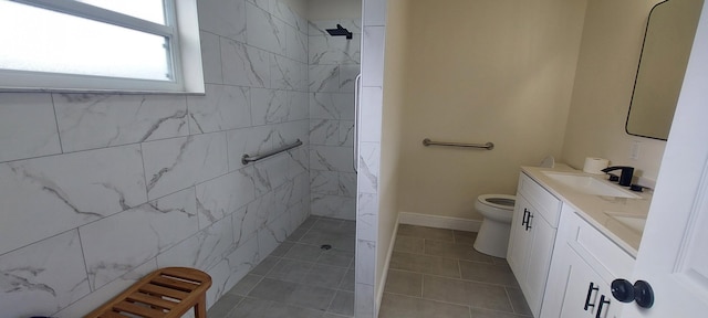 full bath with toilet, a sink, baseboards, double vanity, and walk in shower