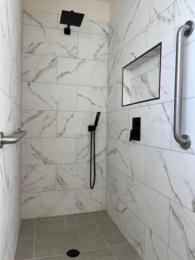 full bathroom with a tile shower