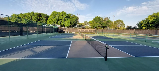 view of sport court featuring fence