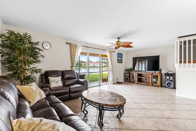 living room with ceiling fan and light tile patterned flooring