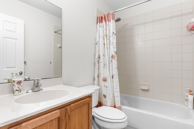 full bathroom featuring shower / bath combo, vanity, and toilet