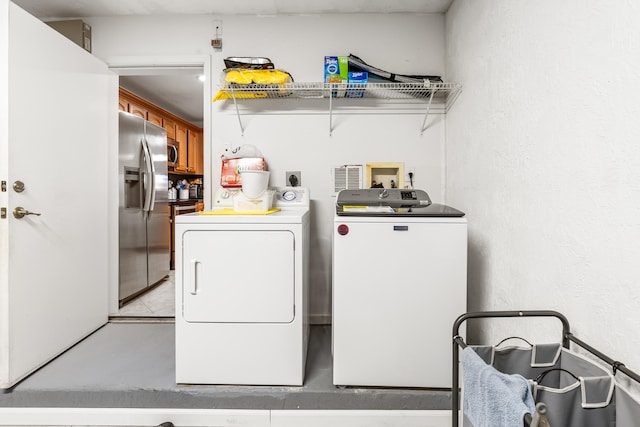 washroom featuring washer and dryer