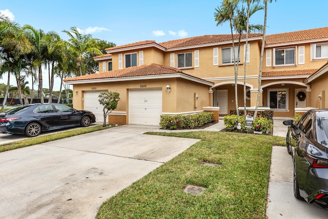 view of front facade featuring a garage and a front yard