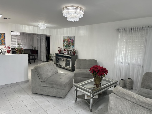 living room with a notable chandelier and a wealth of natural light