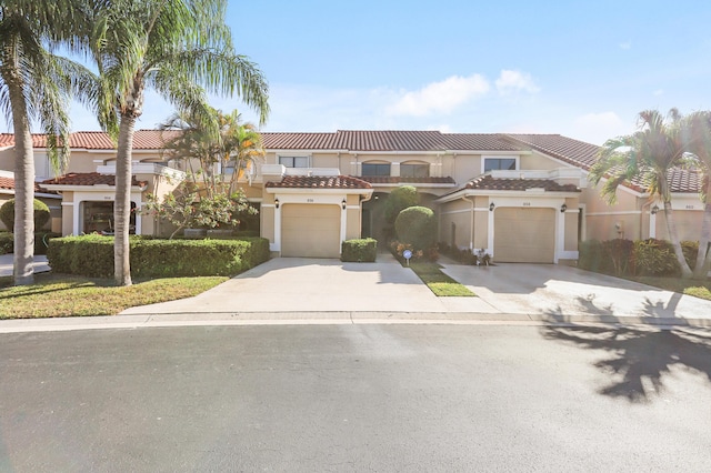 mediterranean / spanish-style home with a garage