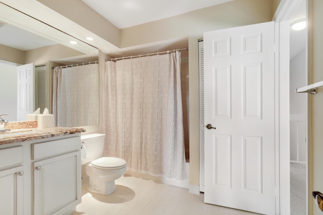 full bathroom featuring vanity, shower / bath combination with curtain, and toilet