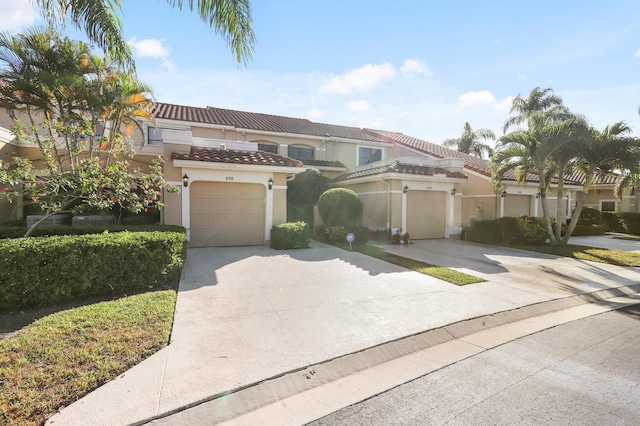 mediterranean / spanish-style house featuring a garage