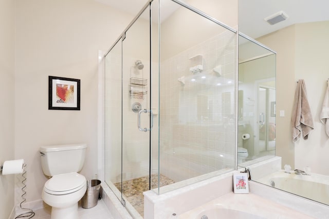 bathroom featuring tile patterned floors, separate shower and tub, and toilet