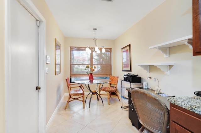 dining area with light tile patterned floors and a notable chandelier