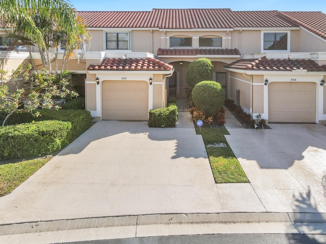 mediterranean / spanish-style house featuring a garage