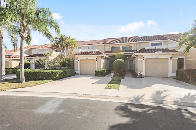 mediterranean / spanish-style home with a garage