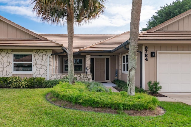 exterior space with a front yard and a garage