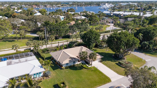 birds eye view of property featuring a water view