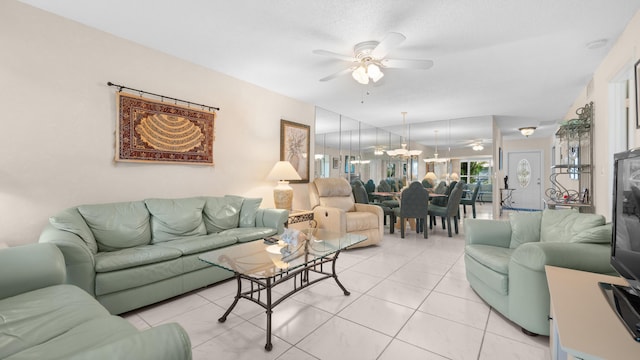 tiled living room featuring ceiling fan