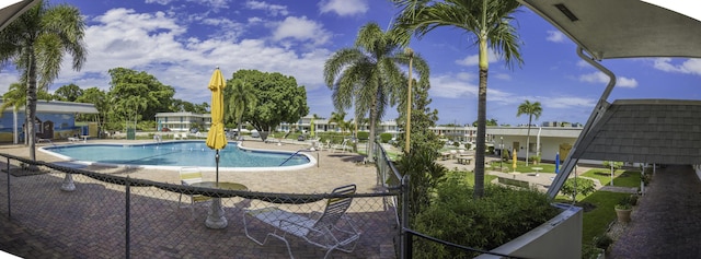 view of swimming pool with a patio area