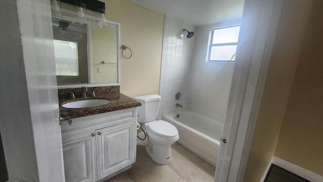 full bathroom featuring tile patterned floors, toilet, vanity, and tiled shower / bath