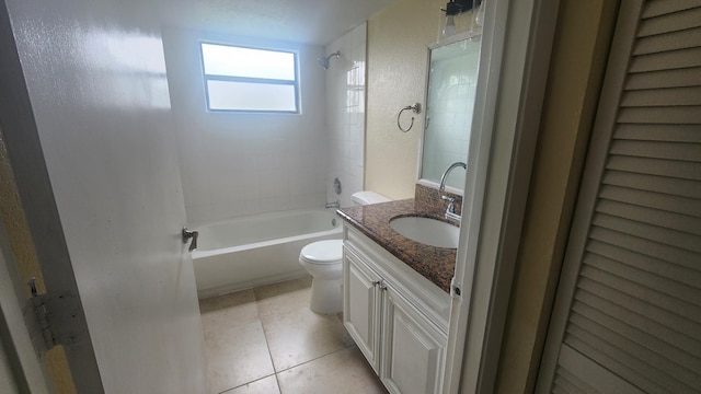 full bathroom with tile patterned floors, vanity, toilet, and tiled shower / bath