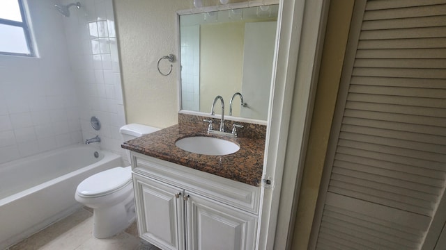 full bathroom featuring vanity, toilet, and tiled shower / bath combo