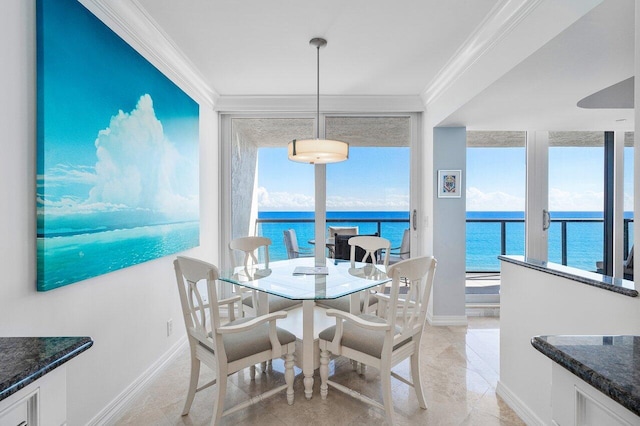 2727 S Ocean Blvd Unit 701, Highland Beach, FL 33487 - dining area featuring crown molding, a water view, baseboards, and plenty of natural light