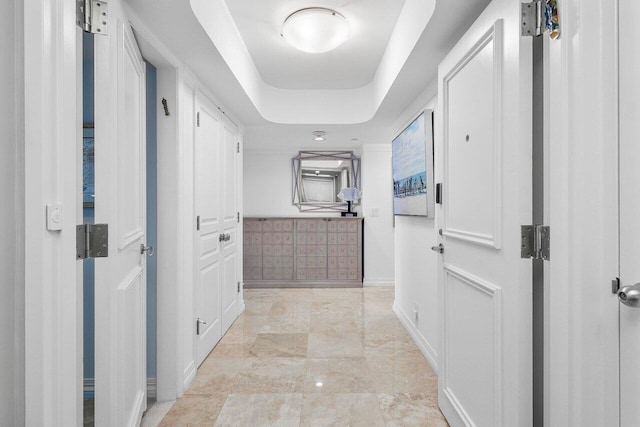 2727 S Ocean Blvd Unit 701, Highland Beach, FL 33487 - corridor with baseboards and a raised ceiling