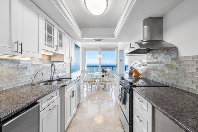 2727 S Ocean Blvd Unit 701, Highland Beach, FL 33487 - kitchen with stainless steel appliances, island exhaust hood, a sink, a tray ceiling, and white cabinets