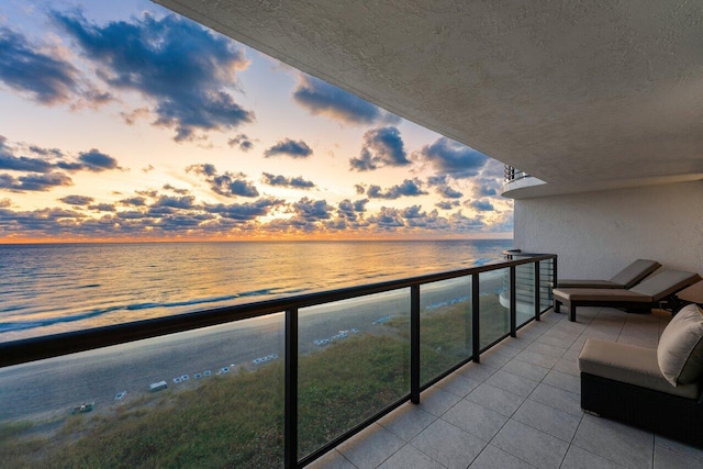 balcony at dusk with a water view