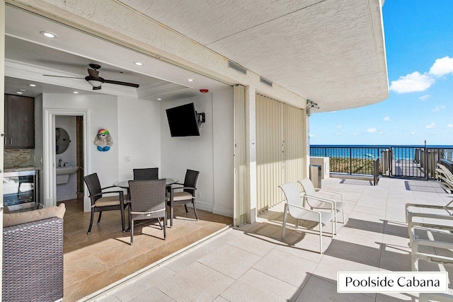 2727 S Ocean Blvd Unit 701, Highland Beach, FL 33487 - view of patio featuring a balcony, a ceiling fan, and outdoor dining space