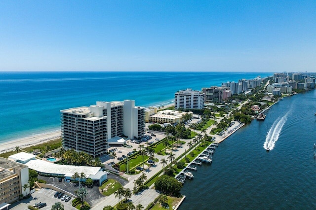 drone / aerial view featuring a view of the beach and a water view